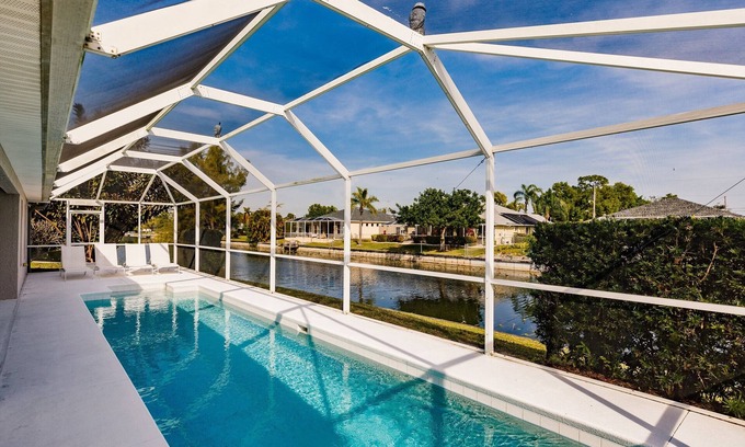 Trafalgar House | Beautiful Cape Coral Home, Outdoor Oasis with Heated Pool on a Freshwater Canal!