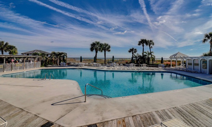 North Forest Beach Villa | Beautifully renovated North Shore Place, pool access, steps from beach!