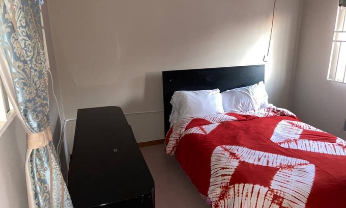 Teshie House | Bedroom 1 in Tropical Accra House