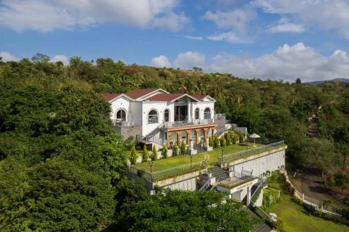 Nashik Villa | Bellevue Palace by StayVista - Lavish abode with a pool, Landscaped lawn, Gazebo & Adventure activities