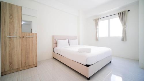 Surabaya Apartment | Best Choice and Homey 2BR at Puncak Dharmahusada Apartment By Travelio