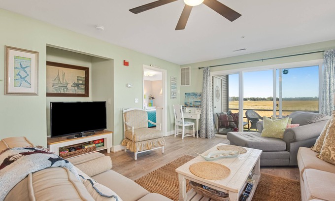 Ocean View Condo | Bethany Bay condo with pool, fireplace, screened porch & AC