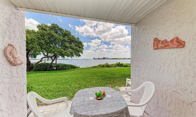 Bradenton Beach House | Blissfull Bay: Runaway Bay - Bayfront Condo! Largest Heated Pool by Anna Maria Life Vacation Rentals