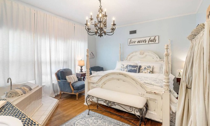 Fort Smith House | Blue Jay suite with king size bed, soaking tub, smart tv, game room and more!