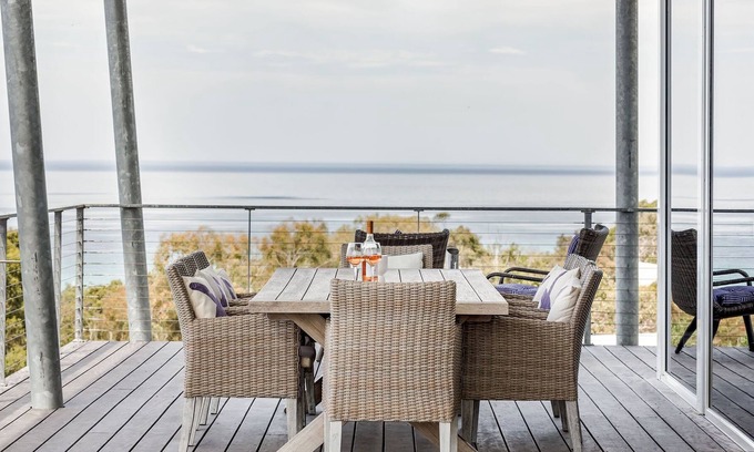 Eagle Bay House | BREATHTAKING VIEWS OVER THE TREETOPS TO THE AZURE WATERS OF THE BAY.