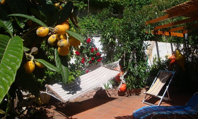 Cala Gonone Apartment | Bright and comfortable apartment, 400 meters from sea. Garden, Air-Con,Terrace.