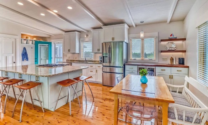 Detroit Lakes House | Bright and Modern Luxe on Long. Peloton bike in unit