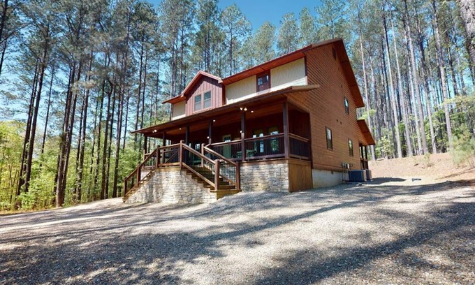 Hochatown Cabin | Bring your ATVs and side by sides to this luxurious 4 bedroom cabin set deep in