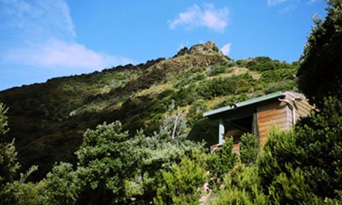 Olmeta di Capocorso Cabin | Cabin in the maquis, terrace and open kitchen with sea and mountain views