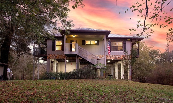 Branford Cabin | Camp Manatee - Riverfront Cabin, Stunning Views, Pet-Friendly, Hot tub + Kayaks!