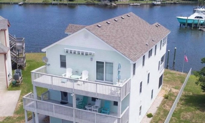 Colington Harbour House | Canal Front Home with Private Dock, Multiple Decks & Hot Tub