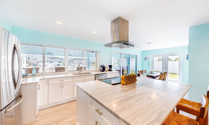 Lochmoor Waterway Estates House | Canal-front home with heated saltwater pool, dock, grill, & covered patio