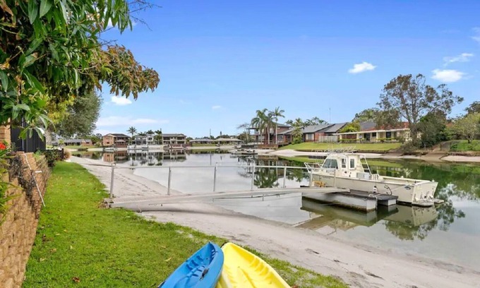 Tweed Heads Apartment | Canal living with private beach, boat ramp, pontoon, fishing and kayaks.
