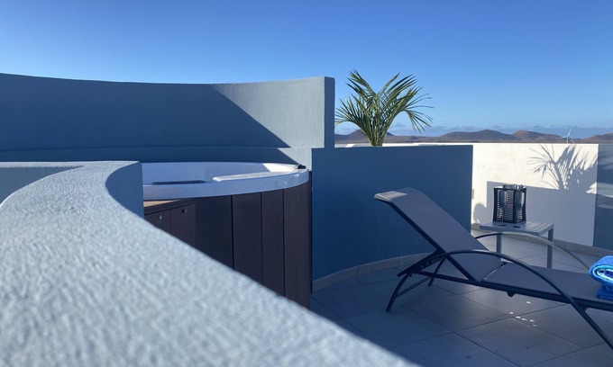 La Oliva Apartment | CASA MAGMA: apartment with roof terrace, private Jacuzzi, ocean & volcano views