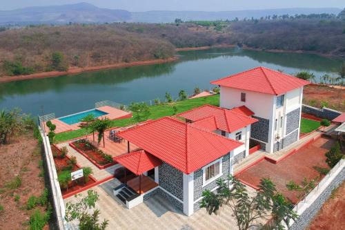Wadgaon Villa | Casa Paun by StayVista - A lake-view villa with Infinity pool, Modern interiors & an amphitheatre
