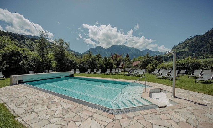 Sankt Johann im Pongau Ski Chalet | "Chalet Lerch" with Mountain View, Garden, Shared Pool & Wi-Fi