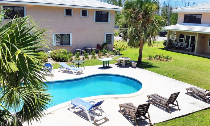 Williams Town Apartment | Charming 1-bed Apartment with Pool and Waterway View - very close to the Beach