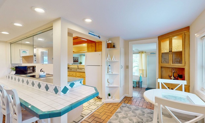Naples Park Cottage | Charming Cottage Steps from Beach - Dog-Friendly with Bikes & Beach Gear