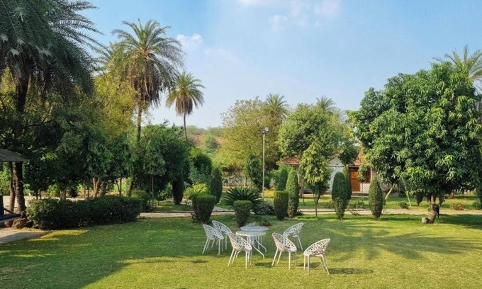 Faridabad Other | Charming farmhouse retreat with lush gardens and serene views