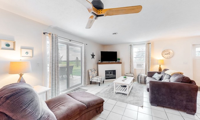 Branchport House | Charming retreat with private hot tub, fireplace, & furnished patio