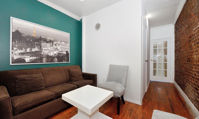 Garment District House | Chic 2BR Midtown West Apartment with Exposed Brick – Steps from Times Square