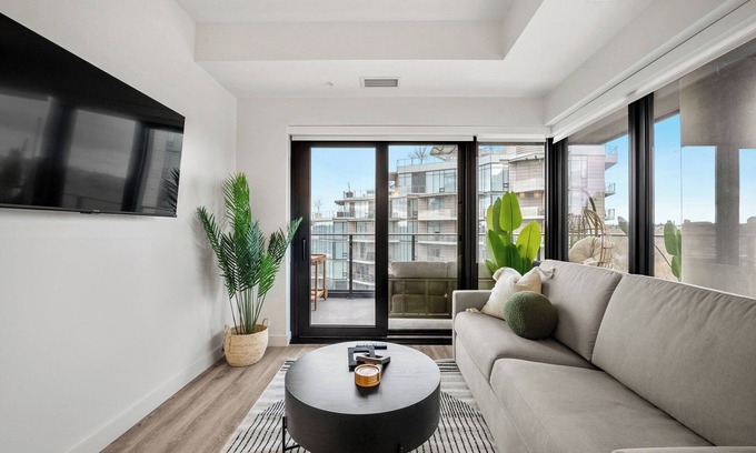 Eau Claire Apartment | City Sophistication w 2 BR River View, Parking, Office