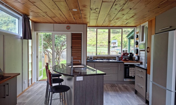 Te Akau House | Classic Kiwi Bach at Sunset Beach