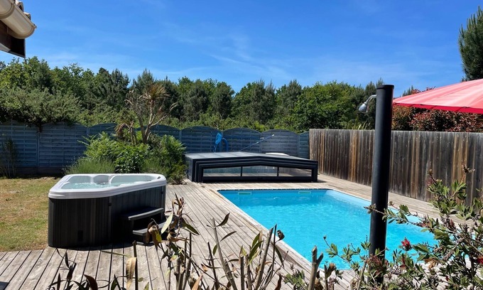 Grayan-Et-L'Hopital House | Close to Soulac/sea air-conditioned chalet, heated indoor swimming pool, jacuzzi