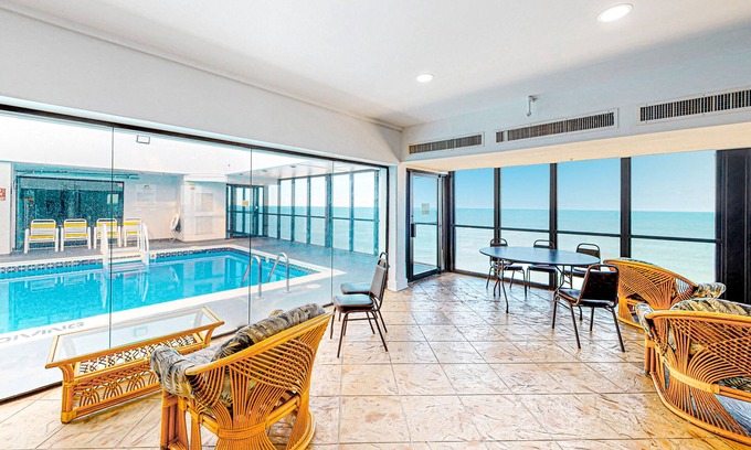 North Ocean City House | Coastal-themed beachfront condo with balcony views, pools, game room & gym