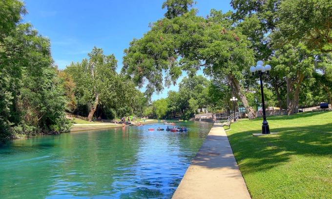 New Braunfels Condo | Comal Riverfront with Pool & Hot tub! Walk to downtown Tube rental next door!