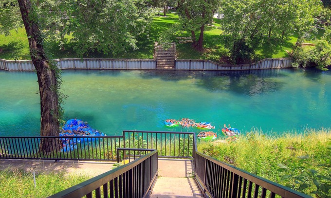 New Braunfels Condo | COMAL RIVERFRONT! Across from Schlitterbahn! Walk to Downtown New Braunfels!