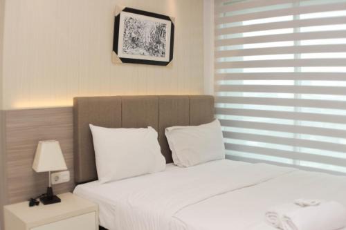 Pekayon Jaya Apartment | Comfort 2BR at Grand Kamala Lagoon Apartment By Travelio