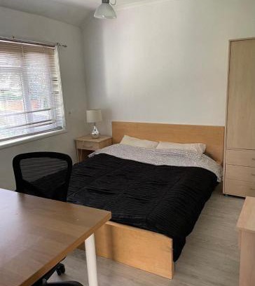 New Eltham House | Comfy garden view bedroom
