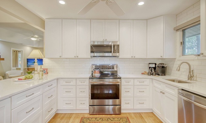 West Beach Cottage | Community pool, dock, river views!