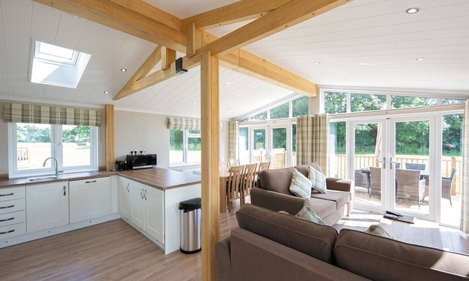 Diss Ski Chalet | Contemporary luxury lodge with luxurious king-size bed.