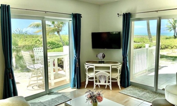 Wheeland Settlement Condo | Corner Ground Floor Oceanfront/Stunning Ocean Views & Easy Beach Access.