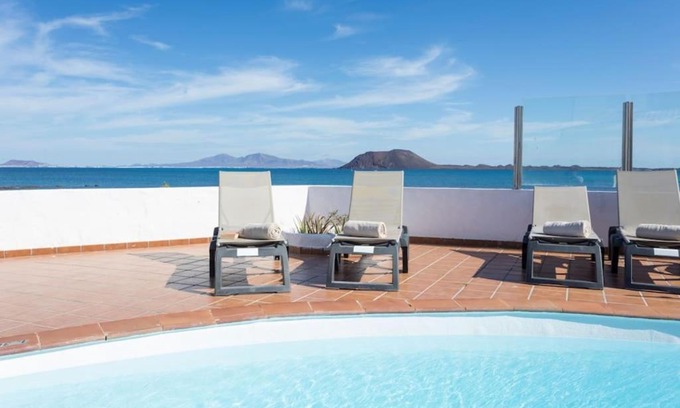 Corralejo Villa | Corralejo Beachfront Villa Remos with Lobos Island View, Private Pool, Wifi & BBQ by Amazzzing Travel