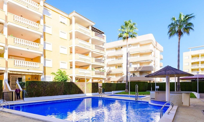 El Grau de Moncofa Apartment | Cosy apartment for 5 guests with pool, WIFI, TV, terrace and pets allowed