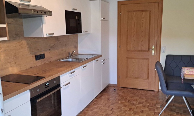 Oberwang Villa | Cosy apartment in villa for 4 guests with WIFI, TV and balcony
