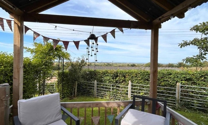 Taunton Cabin | Cosy hut on our Somerset farm with great views, stove and wood fired hot tub