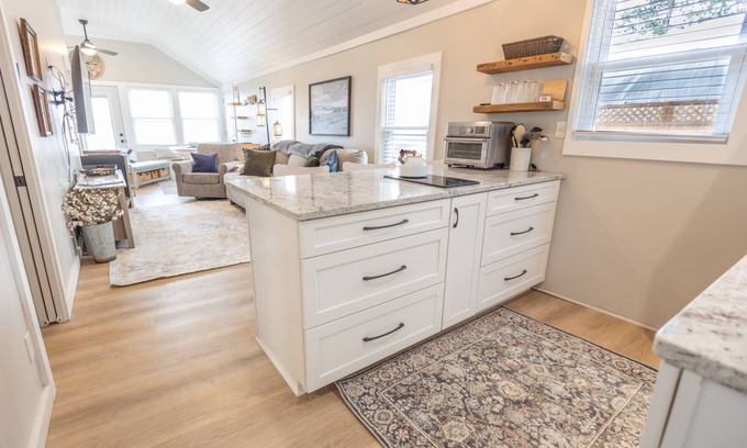 Honor Cottage | Cottage Six on Little Platte Lake with a private dock, kayaks, and a shaded wrap-around deck!