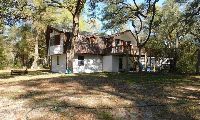 Manattee Road House | Country living at it's best! Rustic 1908 Barn nestled on 2.5 acres of old oaks
