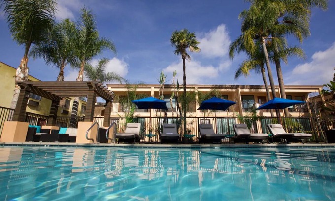 Harbor Hotel | Cove Hotel, King Suite | Relax by the Pool, Sip at the Bar, Stroll Downtown