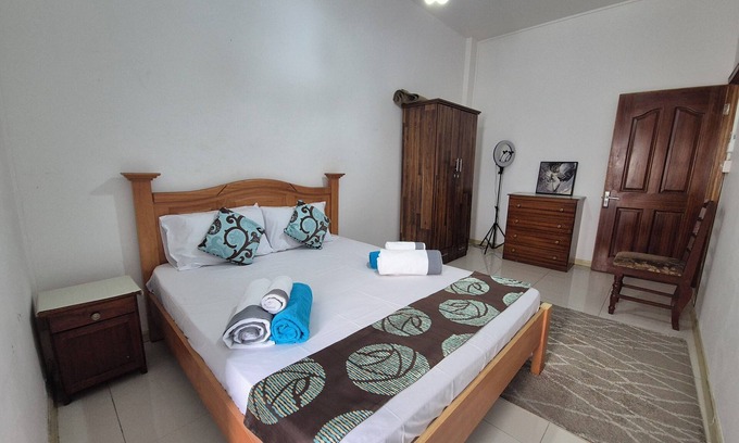 Flic-en-Flac Apartment | Cozy 2-bedroom apartment with rooftop pool, WiFi in soothing Flic en Flac