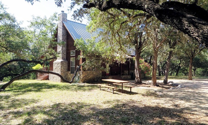 Leakey Cabin | Cozy cedar/rock cabin & bunkhouse with private access to the Frio River.
