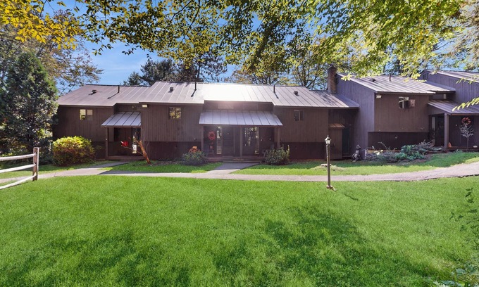 Quechee Condo | Cozy condo w/balcony, river view, electric woodstove, w/d, wifi, kitchen, a/c