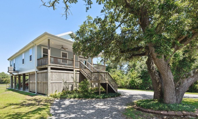 Henderson Point House | Cozy cottage surrounded by woods and just a short walk to the beach!