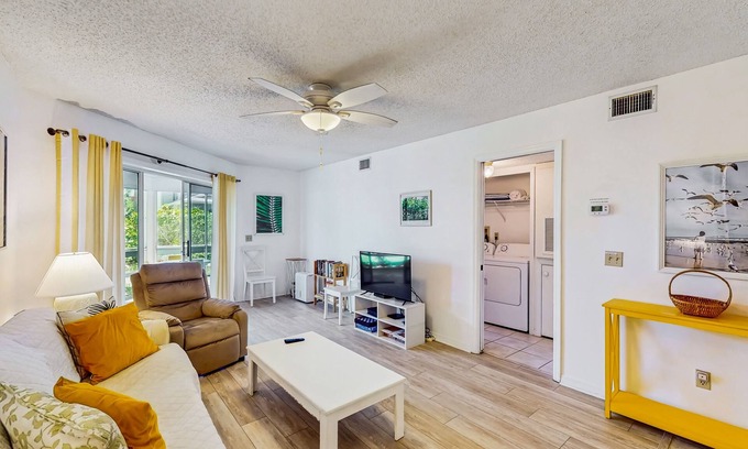 New Smyrna Beach Condo | Cozy Ground-Floor Condo with WiFi, Pools & Sauna - Walk to Beach