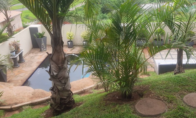Kingsburgh House | Cozy one bedroom suite, with a balcony, overlooking the pool and braai area.