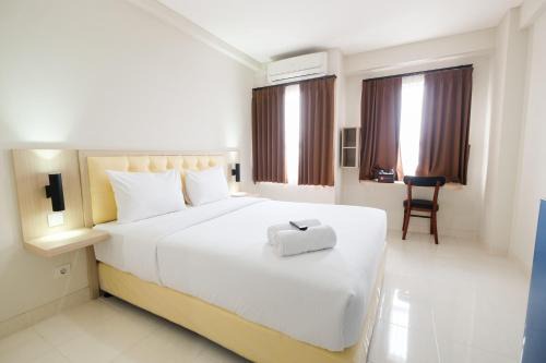 Cikarang Apartment | Cozy Studio with City View at Elvis Tower Apartment By Travelio